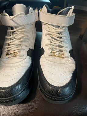 Jordan White and Black High-Top Sneakers with Gold Accents